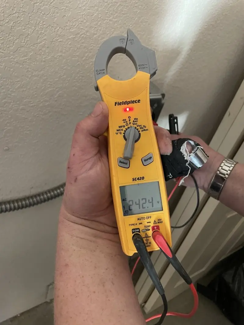 Voltage testing with clamp meter during Recessed Lighting Installation in Lower Macungie